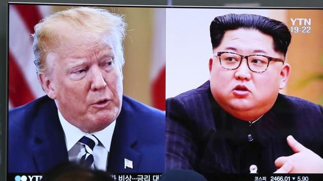 People watch a TV screen showing file footage of U.S. President Donald Trump, left, and North Korean leader Kim Jong Un during a news program at the Seoul Railway Station in Seoul, South Korea.(AP File Photo)