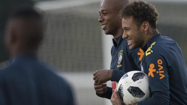 Brazil's Neymar, right, embraces Fernandinho during a national football team practice session. (AP) Brazil's Neymar, right, embraces Fernandinho during a national football team practice session. (AP)