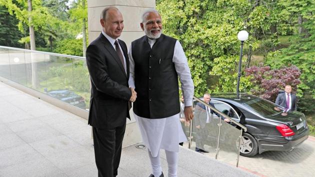 Russian President Vladimir Putin, left, and Indian Prime Minister Narendra Modi during their meeting in the Bocharov Ruchei residence in the Black Sea resort of Sochi, Russia, May 21(AP)