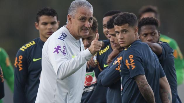 Brazil Coach Tite flashes a thumbs up during a national football team practice session. (AP) Brazil Coach Tite flashes a thumbs up during a national football team practice session. (AP)