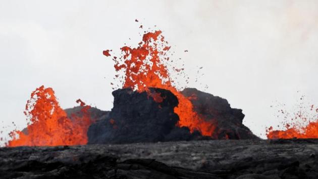 Lava from the Kilauea volcano pours out of a fissure, in the Leilani Estates near Pahoa, Hawaii, on May 26, 2018.(REUTERS) Lava from the Kilauea volcano pours out of a fissure, in the Leilani Estates near Pahoa, Hawaii, on May 26, 2018.(REUTERS)