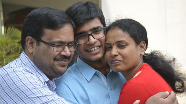 Nakul Gupta, who scored 497 out of 500 in CBSE class 12th exam, celebrates his result with his parents. (Photo Sakib Ali /Hindustan Times) Nakul Gupta, who scored 497 out of 500 in CBSE class 12th exam, celebrates his result with his parents. (Photo Sakib Ali /Hindustan Times)