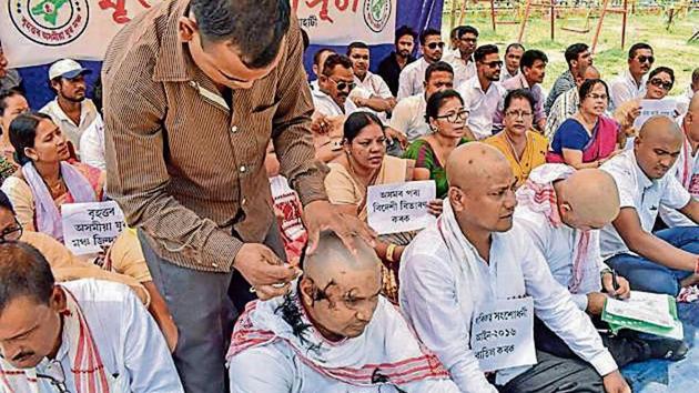 Activists of Brihattar Asomiya Yuva Manch had their heads shaved as a mark of protest against the Citizenship Bill in Guwahati.(PTI File Photo)