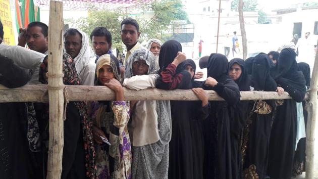 Voters queue up at a polling booth in Sonta Rasoolpur village in Kairana on Monday. (HT Photo) Voters queue up at a polling booth in Sonta Rasoolpur village in Kairana on Monday. (HT Photo)