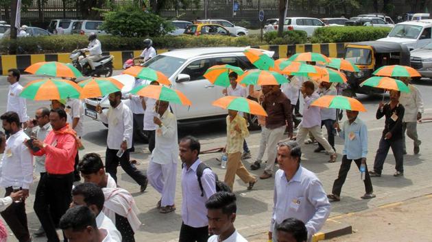 BJP workers attend a rally. Maharashtra chief minister Devendra Fadnavis said the BJP is confident of winning in the Maharashtra bypolls. (Bhushan Koyande/HT File Photo) BJP workers attend a rally. Maharashtra chief minister Devendra Fadnavis said the BJP is confident of winning in the Maharashtra bypolls. (Bhushan Koyande/HT File Photo)