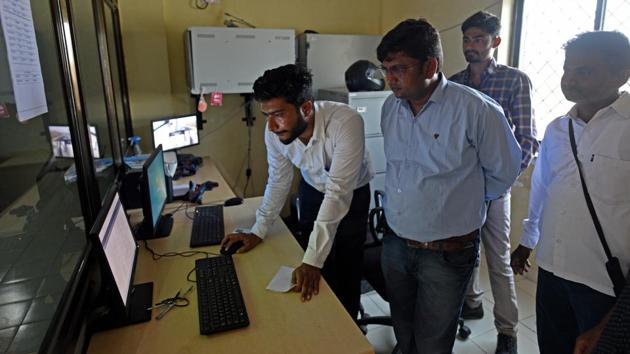 At the control centres, employees can track power production through the day. At 6 am, the panels start to hum, peaking around noon, and begin to ebb at 6 pm. Excess power generated goes to the Gujarat grid and is drawn back from it after dark. There are plans to plug this gap, switching from solar to wind after sundown. (Satyabrata Tripathy / HT Photo) 