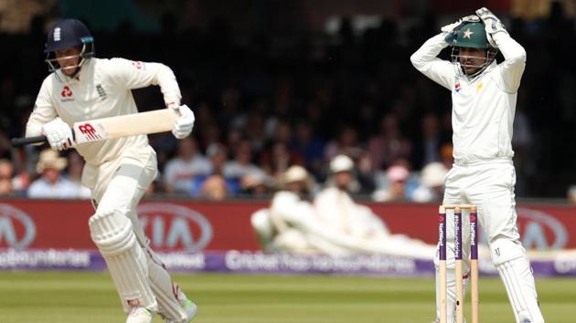 Pakistan's Sarfraz Ahmed (R) reacts as England's Joe Root takes a run during the first Test vs England at Lord’s. Pakistan have been fined for a slow over-rate in the first Test.(REUTERS)