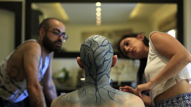 Elias applies make-up before his performance. For over a decade, Lebanon’s LGBT community has focused on activism to combat discrimination and abuse, making startling gains and even carving out space in the mainstream. The community is the most vibrant and open in the Arab world but there is a constant dance between authorities and the community over lines and limits. (Hassan Ammar / AP) Elias applies make-up before his performance. For over a decade, Lebanon’s LGBT community has focused on activism to combat discrimination and abuse, making startling gains and even carving out space in the mainstream. The community is the most vibrant and open in the Arab world but there is a constant dance between authorities and the community over lines and limits. (Hassan Ammar / AP)