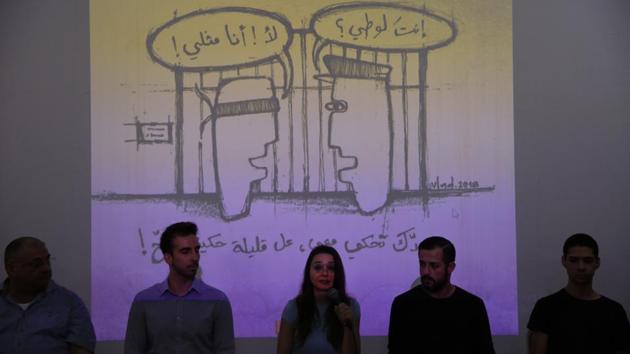 Members of Helem speak during a press conference in Beirut. Arabic on the wall reads “Are you a sodomite? No I am homosexual. If you want to talk to me, at least do it properly.” Lebanon’s activists in collaboration with Palestinians, have introduced a new, positive Arabic word for homosexual, “mithli,” to replace the more common, derogatory term, “shazz,” or “deviant.” (Hassan Ammar / AP) Members of Helem speak during a press conference in Beirut. Arabic on the wall reads “Are you a sodomite? No I am homosexual. If you want to talk to me, at least do it properly.” Lebanon’s activists in collaboration with Palestinians, have introduced a new, positive Arabic word for homosexual, “mithli,” to replace the more common, derogatory term, “shazz,” or “deviant.” (Hassan Ammar / AP)