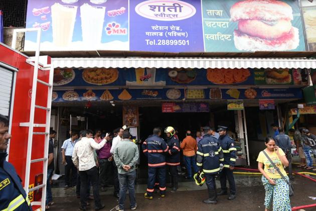 Fire-fighting operations at Gupta Market, near Malad station, on Tuesday.(Satyabrata Tripathy/HT Photo)