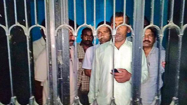 Officials of the raiding team locked up at the Panchayat Bhawan in Shekhpura Jagir village in Karnal on Monday. (HT Photo) Officials of the raiding team locked up at the Panchayat Bhawan in Shekhpura Jagir village in Karnal on Monday. (HT Photo)