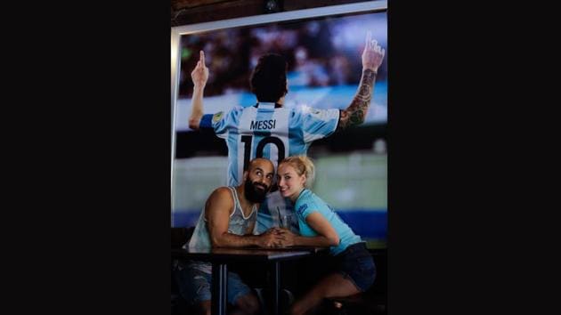 “Messi is playing, he’s from Rosario. Tell me: why is there not a line outside to watch this game?” Oshin Gharibi asked watching a match at a nearly empty bar with his girlfriend Lena Wagner who wore a royal blue away Barcelona shirt with Messi’s number 10 on the back. “Messi is such a big star from such a small place. How can you not give him the recognition that he deserves?” (Natacha Pisarenko / AP)