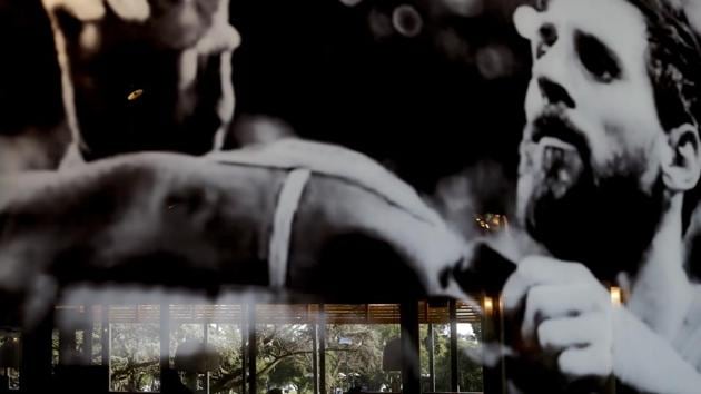 Customers are reflected in a picture of Lionel Messi at the VIP restaurant owned by Messi’s family in his hometown of Rosario, Argentina. No statues or museums stand here in honour of the footballer, but everyone seems to agree: the Messi’s are a humble, decent family; Lionel was a good kid, and he only cared about one thing only: football. (Natacha Pisarenko / AP)