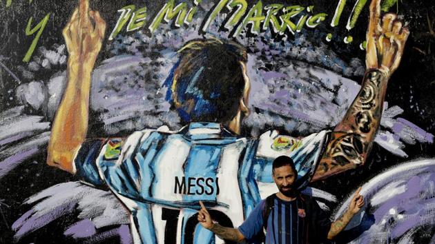 As a wedding gift, some of his childhood friends in La Bajada painted a large mural on a wall at a small field where they used to play as kids. It shows a bearded Messi surrounded by colourful planets, and on a corner it reads: “From another galaxy — and from my neighbourhood as well.” (Natacha Pisarenko / AP)