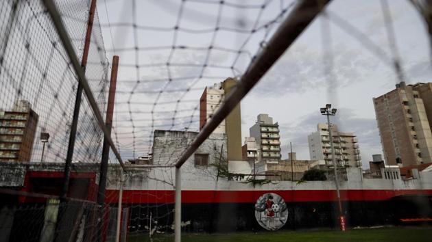 A small mural depicting Lionel Messi as a child decorates the wall at a football field used by the Newell’s Old Boys youth team, Messi’s childhood club, in Rosario. Messi played for Rosario’s local team before signing with Barcelona at age 13. The mural is the only sign that he was a standout player here as a child. (Natacha Pisarenko / AP)