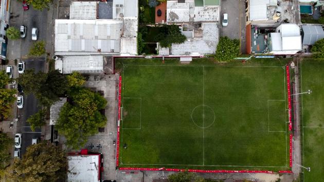 “You breathe football everywhere in Rosario, but, curiously, the air doesn’t smell of Messi,” author Guillem Balague writes in “Messi,” the official biography. Everybody seems to have a story about him, but “the city does not seem to want to gloat. It’s almost as if it is considered vulgar to have his face posted everywhere. Or perhaps they have just decided to respect his low profile,” Balague says. (Natacha Pisarenko / AP)