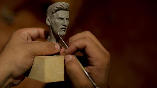 Scultptor Sandro Alzugaray holds a scale model of a Lionel Messi statue at his atelier in Rosario. Alzugaray’s proposal to create a monument honouring Messi has stalled since the previous World Cup but he is confident that some day it will be approved by the city and that he'll find the financial support to make it happen. (Natacha Pisarenko / AP)