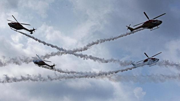 The Sarang helicopter team displays formations during PT & Equitation display during the convocation ceremony of 134th course of National Defence Academy (NDA) in Pune. (Pratham Gokhale/HT Photo)