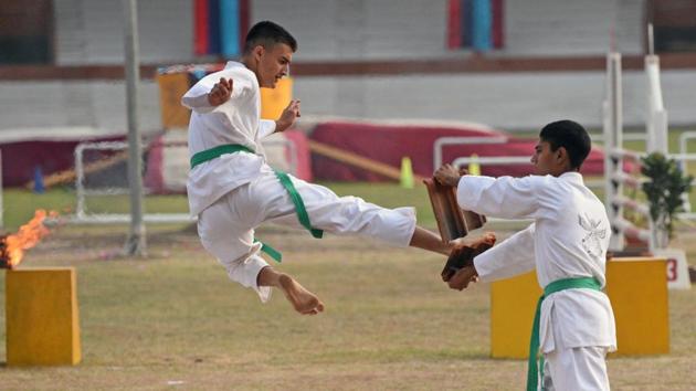 Cadets display karate skills during PT & Equitation display during the convocation ceremony of 134th course of National Defence Academy (NDA) in Pune. (Pratham Gokhale/HT Photo)