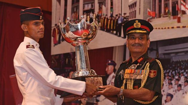 Cadet Mittal Prajapati receives award from the chief guest, Lieutenant General Satish Dua, current Chief of Integrated Defence Staff to the Chairman Chiefs of Staff Committee of the Indian Armed Forces during the convocation ceremony of 134th course of National Defence Academy (NDA) in Pune. (Pratham Gokhale/HT Photo)