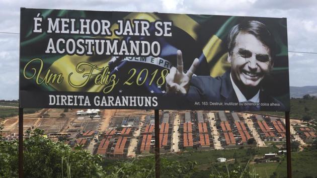 A billboard of presidential candidate Jair Bolsonaro stands tall in Garanhuns city. Largely unknown until recently in the region, the conservative from Rio de Janeiro has softened his attacks on da Silva in hopes of luring disappointed supporters. “People want an honest president and Bolsonaro is that. Lula’s mask has fallen. He is a saboteur,” said martial arts teacher Daniel Bastos. (Eraldo Peres / AP) 
