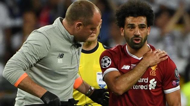 Mohamed Salah was forced out of the Champions League final in tears on Saturday clutching his left shoulder after being wrestled to the ground by Real Madrid captain Sergio Ramos.(AFP)