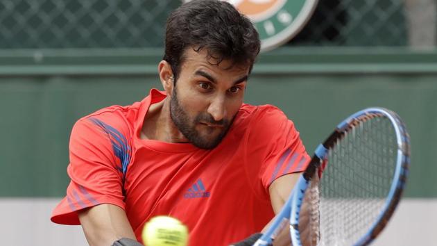 Yuki Bhambri returns a shot against Belgium's Ruben Bemelmans during their first round match at the French Open.(AP)