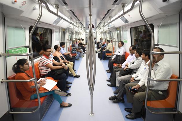 Passengers travel by the Magenta line metro after the Kalkaji Mandir-Janakpuri West stretch became open to public on Tuesday.(Burhaan Kinu/HT Photo)