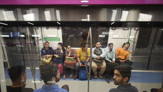 Passengers travel aboard the Magenta Line Metro at Nehru Enclave metro station, after the Kalkaji Mandir-Janakpuri West stretch opened to the public, making the metro line fully operational from Noida's Botanical Garden to West Delhi's Janakpuri in New Delhi. (Burhaan Kinu / HT Photo) Passengers travel aboard the Magenta Line Metro at Nehru Enclave metro station, after the Kalkaji Mandir-Janakpuri West stretch opened to the public, making the metro line fully operational from Noida's Botanical Garden to West Delhi's Janakpuri in New Delhi. (Burhaan Kinu / HT Photo)