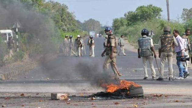 Police patrol the Mhow-Neemuch highway on June 07, 2017, after clashes with the farmers killed six people in Mandsaur, Madhya Pradesh, a day before.(Mujeeb Faruqui/HT file photo)