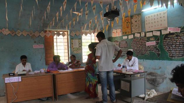 People vote at a polling booth during Lok Sabha by-election at Vikramgad Taluka in Mumbai.(Pramod Thakur/HT File Photo)