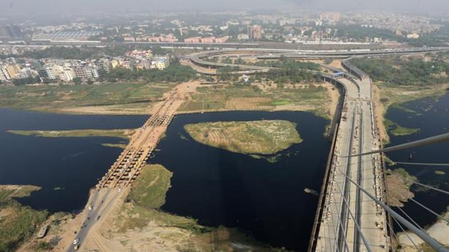 An aerial view of the Yamuna river along with Signature Bridge at Wazirabad in New Delhi on Tuesday. Delhi chief minister Arvind Kejriwal said that within four months residents of Delhi and tourists will be able to witness this view. The bridge connects Wazirabad across the river Yamuna to the inner city. (Sonu Mehta / HT Photo) An aerial view of the Yamuna river along with Signature Bridge at Wazirabad in New Delhi on Tuesday. Delhi chief minister Arvind Kejriwal said that within four months residents of Delhi and tourists will be able to witness this view. The bridge connects Wazirabad across the river Yamuna to the inner city. (Sonu Mehta / HT Photo)
