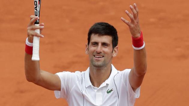 Serbia's Novak Djokovic celebrates after victory over Brazil's Rogerio Dutra Silva after their men's singles first round match on day two of The Roland Garros 2018 French Open tennis tournament in Paris on May 28, 2018.(AFP)