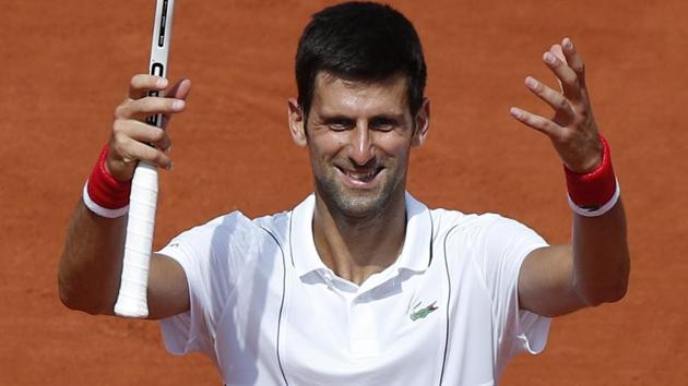 Novak Djokovic celebrates after winning his French Open second round match against Jaume Munar. (AP) Novak Djokovic celebrates after winning his French Open second round match against Jaume Munar. (AP)