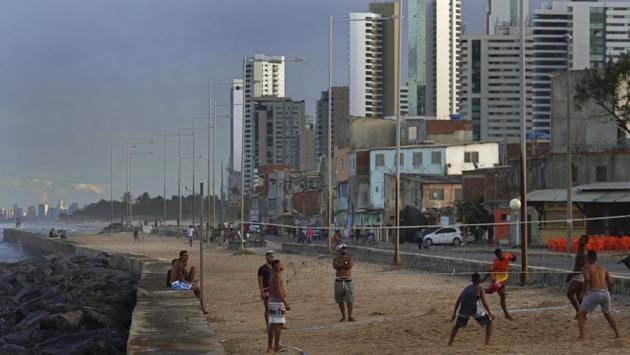 In letters from jail, da Silva has said he plans to run in part because not doing so would be akin to admitting guilt. “We feel like orphans,” Natalia Oliveira said at the bar she owns in Brasilia Teimosa, a neighbourhood in Recife that was transformed from a dangerous slum into a modern beachfront area during da Silva’s second term. “Who will we vote for? It is so sad, but that’s where we are at.” (Eraldo Peres / AP) 