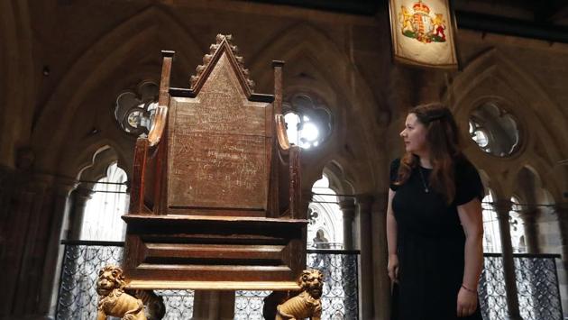 A woman looks at the coronation chair of Queen Mary II which will exhibit at the Jubilee Galleries. This replica for the coronation of William of Orange and Mary in 1689 accompanied the coronation chair that rests in St. George’s Chapel and has been used in English coronations for over 700 years. (Frank Augustein / AP) A woman looks at the coronation chair of Queen Mary II which will exhibit at the Jubilee Galleries. This replica for the coronation of William of Orange and Mary in 1689 accompanied the coronation chair that rests in St. George’s Chapel and has been used in English coronations for over 700 years. (Frank Augustein / AP)