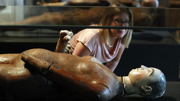A woman looks at a funeral effigy of Queen Mary at the The Queen's Diamond Jubilee Galleries. The Abbey has an unsurpassed collection of wax and wood life-size effigies of English royalty and aristocracy going as far back as the 14th century. Carried in the funeral processions alongside the casket, most come clothed in the personal garments of the individuals. (Frank Augustein / AP) A woman looks at a funeral effigy of Queen Mary at the The Queen's Diamond Jubilee Galleries. The Abbey has an unsurpassed collection of wax and wood life-size effigies of English royalty and aristocracy going as far back as the 14th century. Carried in the funeral processions alongside the casket, most come clothed in the personal garments of the individuals. (Frank Augustein / AP)