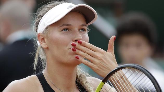 Caroline Wozniacki celebrates after defeating Spain's Georgina Garcia Perez during their French Open second round match.(AP)