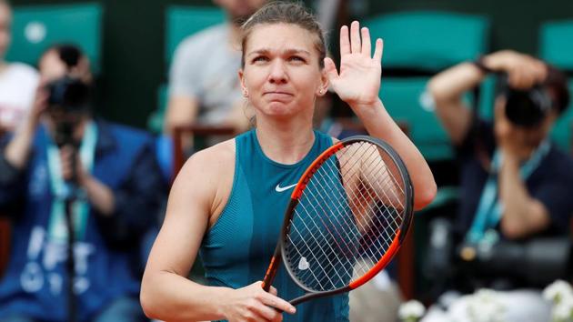 Simona Halep celebrates after winning her French Open first round match against Alison Riske on Wednesday.(REUTERS)