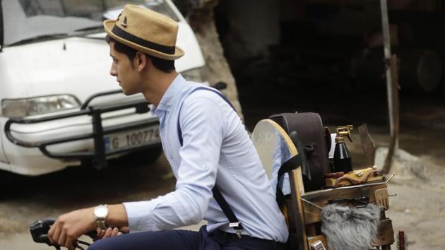 “I used to love watching the barber near my parent’s house. I’d come back from school, drop off my backpack, and go to his shop,” Abo Tawila said. “He told me to come to the salon after school if I like this job. But I decided to leave school altogether to work with him.” (Joseph Eid / AFP) “I used to love watching the barber near my parent’s house. I’d come back from school, drop off my backpack, and go to his shop,” Abo Tawila said. “He told me to come to the salon after school if I like this job. But I decided to leave school altogether to work with him.” (Joseph Eid / AFP)