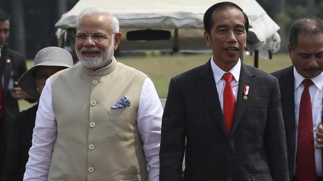 Prime Minister Narendra Modi,walks with Indonesian President Joko Widodo upon arrival at the National Monument Monas for an India-Indonesia kite exhibition in Jakarta, Indonesia, Wednesday 30, 2018.(AP)
