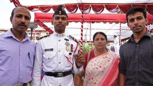 Bronze medalist cadet Ali Ahmed Choudhury poses for photo with his family members after passing out parade of 134th course of spring term 2018 at National Defence Academy (NDA) in Pune. (Pratham Gokhale/HT Photo)