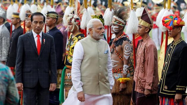 Prime Minister Narendra Modi reviews guard of honour accompanied by Indonesia President Joko Widodo at the presidential palace in Jakarta, Indonesia.(Reuters Photo) Prime Minister Narendra Modi reviews guard of honour accompanied by Indonesia President Joko Widodo at the presidential palace in Jakarta, Indonesia.(Reuters Photo)