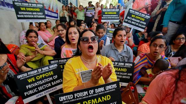 Bank employees raise slogans and carry placards during a protest, as part of a 48-hour long strike in Chandigarh. The two-day nationwide strike by employees of 20 state-owned, 12 private sector, and seven foreign bank is against a meagre 2% salary hike offered by the Indian Banks Association. (Ajay Verma / REUTERS) 