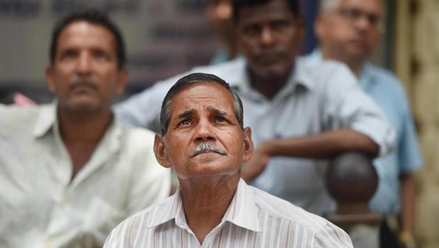 nvestors react while watching the stock prices at a display screen at the Bombay Stock Exchange building in Mumbai. (PTI Photo) nvestors react while watching the stock prices at a display screen at the Bombay Stock Exchange building in Mumbai. (PTI Photo)