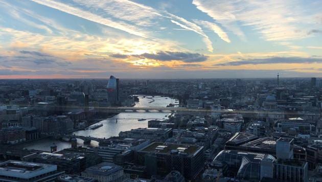 A view of London as seen from inside Sky Garden atop a 34-story building known as the Walkie Talkie. It's hard to walk in for a look without a ticket, but timed tickets are free, though sunset hours go fast.(AP) A view of London as seen from inside Sky Garden atop a 34-story building known as the Walkie Talkie. It's hard to walk in for a look without a ticket, but timed tickets are free, though sunset hours go fast.(AP)