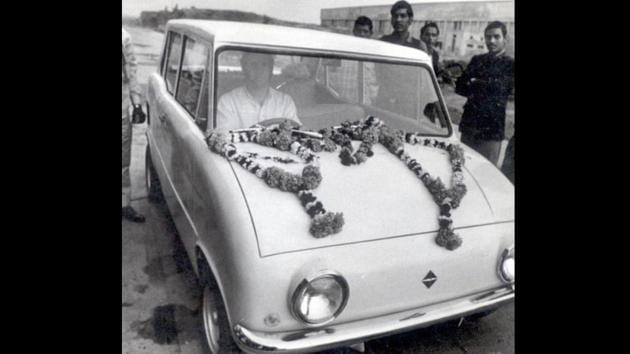 Sanjay Gandhi drives a test model of the first ever car designed by Maruti. The car is said to have been designed by Gandhi himself at a small workshop in Delhi and used a motorcycle engine for power. Three such cars were made before the company shifted to Gurgugram. (HT Archive)