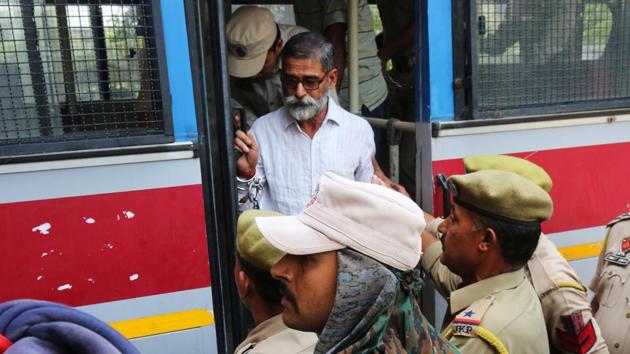 Sanji Ram, one of the eight accused in the rape and murder of an eight-year-old girl in Kathua arrives for a court appearance in Pathankot, Punjab on Thursday. The trial in the case began in Pathankot today with seven of the eight accused being produced before the district and sessions judge after the Supreme Court shifted the hearing outside Jammu and Kashmir. (Mukesh Gupta / REUTERS) Sanji Ram, one of the eight accused in the rape and murder of an eight-year-old girl in Kathua arrives for a court appearance in Pathankot, Punjab on Thursday. The trial in the case began in Pathankot today with seven of the eight accused being produced before the district and sessions judge after the Supreme Court shifted the hearing outside Jammu and Kashmir. (Mukesh Gupta / REUTERS)