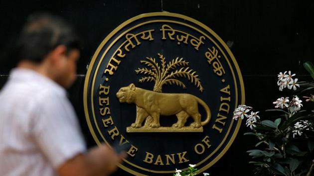 A man checks his phone outside the Reserve Bank of India (RBI) headquarters in Mumbai, India. (REUTERS File Photo) A man checks his phone outside the Reserve Bank of India (RBI) headquarters in Mumbai, India. (REUTERS File Photo)