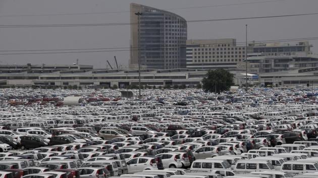 A sea of Maruti Suzuki vehicles seen lined up at the company’s IMT Manesar plant in Haryana. From those initial days, Maruti has grown exponentially into an automobile behemoth just as its birthplace Gurugram has as a metropolis. The monolithic Maruti Suzuki factory today is one of countless manufacturing and economic entities that make up Gurugram. (Parveen Kumar / HT Archive)